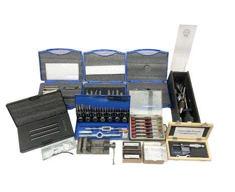 Collection of various clock repair tools and accessories, to include lathe tailstock chocks, optical centre punch, HS tool bi