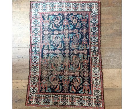 An Eastern red ground rug 150 x 100 cm