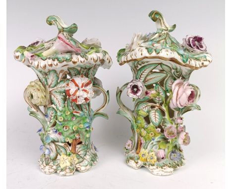 A pair of Victorian pot pourri pierced vases and covers, with floral encrusted decoration, 19 cm highSome loss as usual