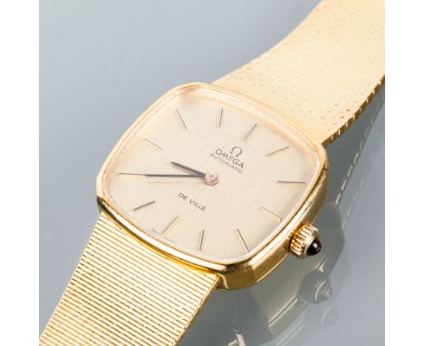 EIGHTEEN CARAT GOLD MID SIZED OMEGA DE VILLE AUTOMATIC WRISTWATCH
the gold tone dial with applied baton numerals, the cushion