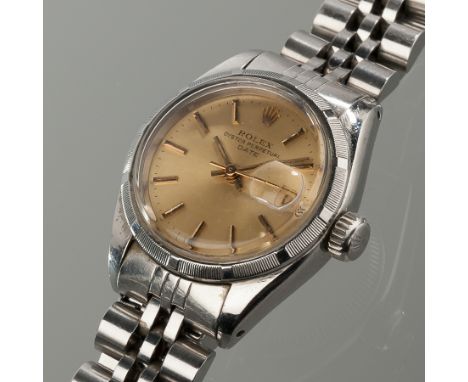 LADY'S STAINLESS STEEL ROLEX OYSTER PERPETUAL DATE WRISTWATCH
the champagne dial with baton numerals and date aperture and cy