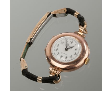 LADY'S NINE CARAT ROSE GOLD PRECISTA WYLER COCKTAIL WATCH
the white dial with raised Arabic numerals, in nine carat rose gold