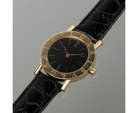 OUTSTANDING LADY'S EIGHTEEN CARAT GOLD BVLGARI DRESS WATCH
the black dial with gold baton hour markers and arabic numerals at