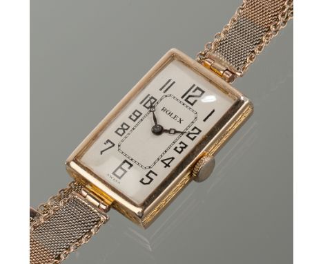 LADY'S ART DECO NINE CARAT YELLOW GOLD RECTANGULAR ROLEX PRIMA WRISTWATCH
the white dial with stylised Arabic numerals, in ni