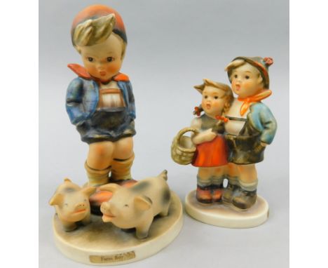 A Goebel Hummel figure Farm Boy, and another Surprise. (2)