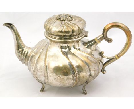 A Danish white metal melon shaped teapot, early 20thC, of spiral fluted form, raised on four cabriole legs, initial A Halbers