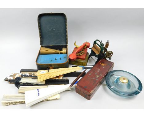 Miscellaneous items, to include a child's tin plate sewing machine, a telephone, a mangle, various fans, a tin plate miniatur