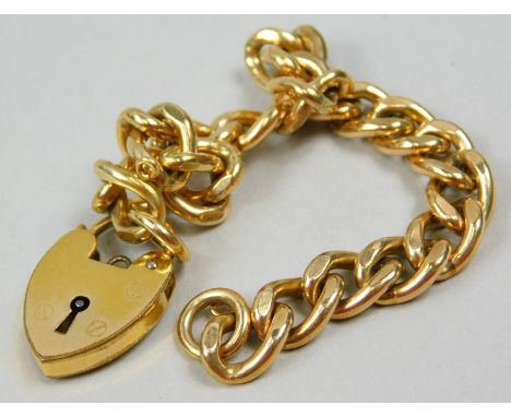 A gate bracelet, with curb links, marked to rings and padlock 9ct gold metal core. 