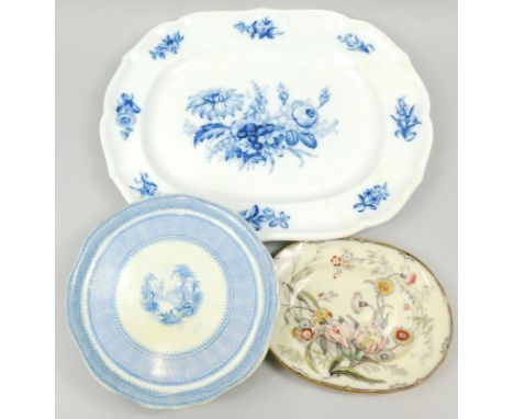 A 19thC blue and white meat platter, of shaped outline, decorated with flower heads, 59cm wide, and Envn blue and white trans