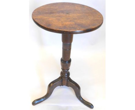 A 19thC oak occasional table, with a circular top, on turned column and tripod base, the top 30cm diameter