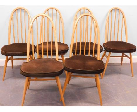 An Ercol light elm drop leaf oval kitchen table and six chairs