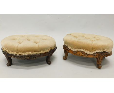 Two Victorian mahogany oval foot stools, each with a button padded top, on short leaf carved cabriole legs, 36cm wide.