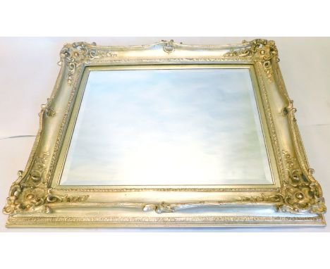 A silvered gesso wall mirror, with a rectangular bevelled plate, 104cm x 87cm