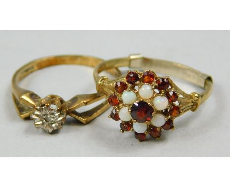 Two dress rings, to include a 9ct gold dress ring, set with red and opal effect stones, and a 9ct gold white stone set dress 