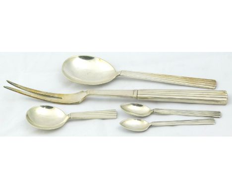 A collection of Georg Jensen sterling cutlery, to include a two pronged carving fork, tea caddy spoon, two coffee spoons etc,