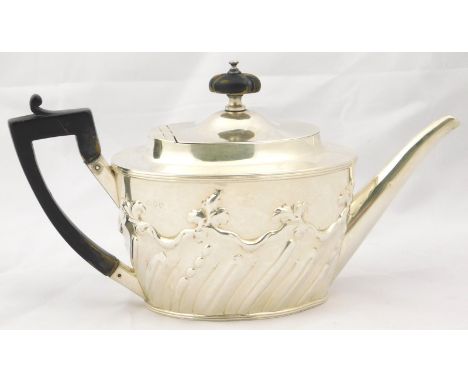 A Victorian oval silver teapot, with fluted and leaf embossed decoration, London 1890, 13oz