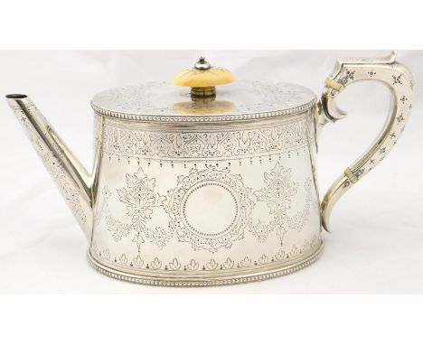 A Victorian silver teapot, of oval form, engraved with garlands of flowers, central circular cartouches, London 1881, 22¾oz a