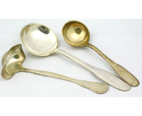 Various Danish serving pieces, comprising a ladle, another, and a toddy ladle, 19cm wide, with a part beaded and hammered han