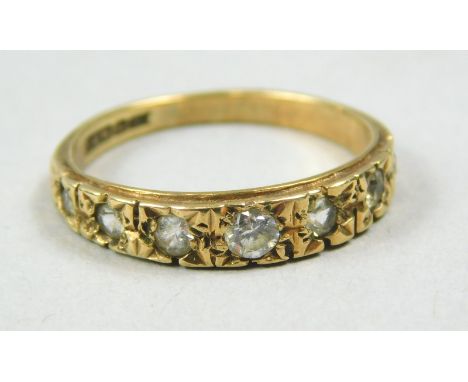 A 9ct gold dress ring, set with six tiny white stones, 1.8g all in. 