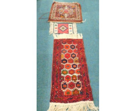 A Persian style rug, with a central medallion, on a navy blue ground, a kilim mat and a small runner decorated with multi col