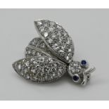 1 Brosche WG 18ct. "Käfer" mit Brillanten wohl bis zu ca. 0,07ct., wohl 2 kleine Saphire, Gesamtläng