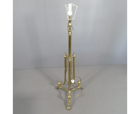 A telescopic brass Corinthian style standard lamp on tripod stand. H (tallest - 179cm). With shade. 