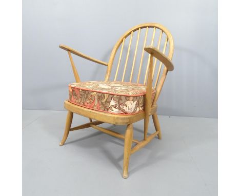 A mid-century beech Windsor lounge chair in the manner of Ercol, with cushion over sprung seat.Various marks and scratches. L