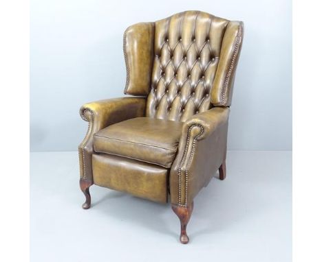 A button-back leather upholstered reclining armchair. Overall 80x112x90cm, seat 48x50x54cm. 