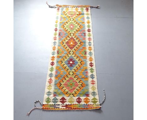 A Chobi Kilim runner. 210x64cm. 