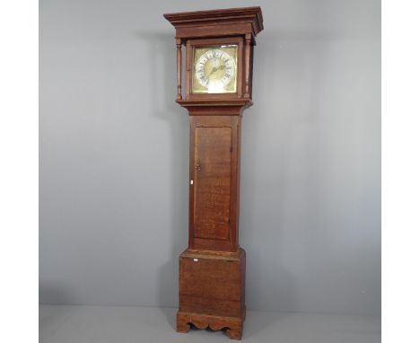 An 18th century oak longcase clock, 30 hour movement, with date aperture. 11'' square dial complete with pendulum and weight.