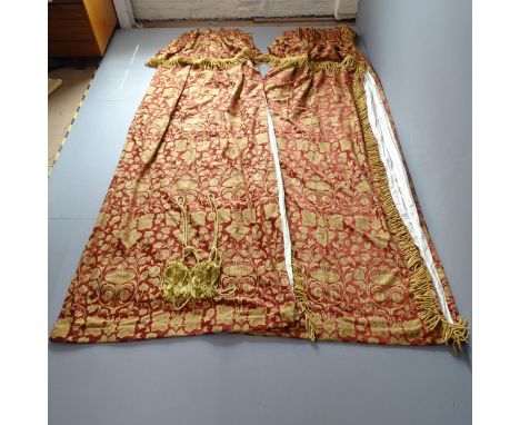 Two pairs of good quality red and gold lined curtains with floral brocade design and drop fringe headers and fringed sides, b