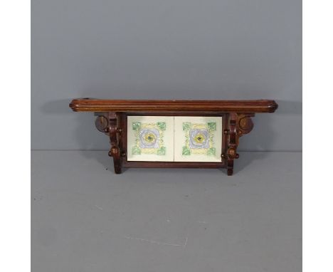 An Art Nouveau hanging shelf, with tile back. 60x25x18cm. 