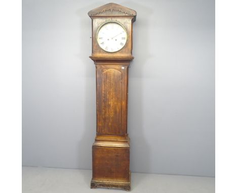 An antique oak cased 8 day longcase clock, with 12 inch enamelled dial. Complete with pendulum, 2 weights, and winding key. V