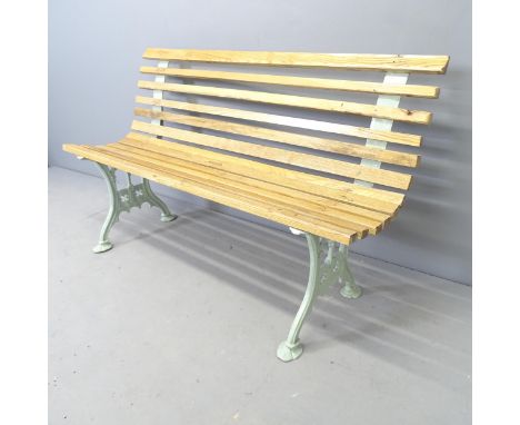 A pine slatted garden bench with painted gothic cast iron ends. 170x74x44cm. 