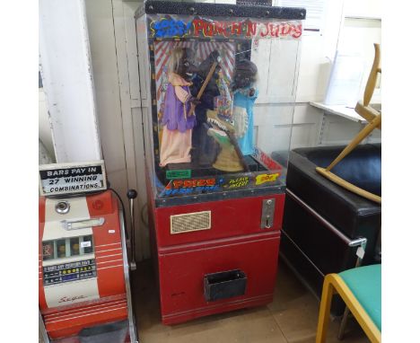 A vintage Punch and Judy arcade machine with automaton characters. 57x142x54cm. 
