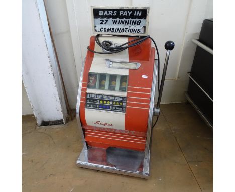 A 1960s Sega Copper Star One Arm Bandit penny arcade slot machine. 