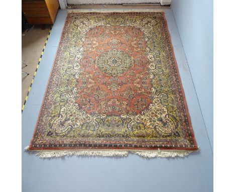 A salmon and cream-ground Persian style carpet. 290x202cm. 