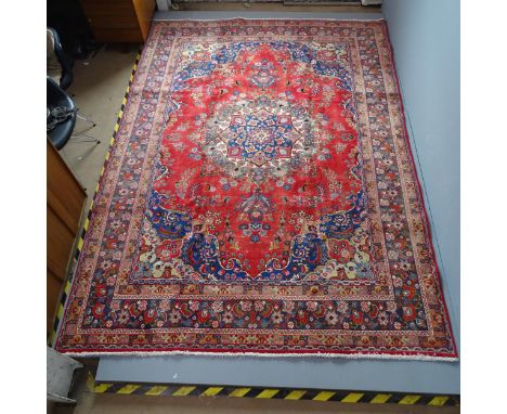 A red-ground Meshed carpet. 330x240cm. 