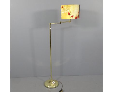 A modern brass standard lamp with swing arm. Height to bayonet 135cm. 