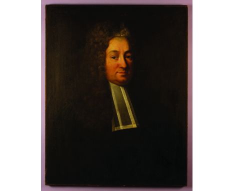 An Early 18th Century Oil on Canvas: Head & Shoulders Portrait of a Cleric wearing a long curly wig, 29½ ins x 23 ins (75 cm 