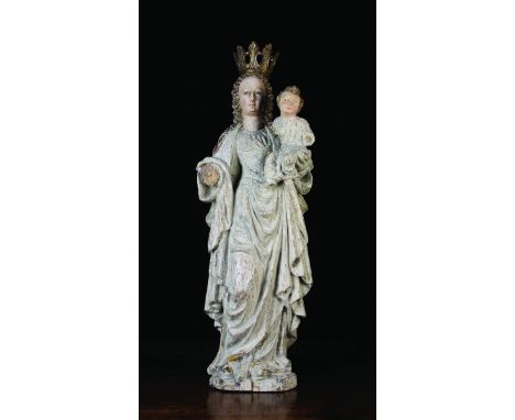 A Late 16th Century Polychromed Wood Carving of Virgin & Child. Mary depicted with long wavy hair hanging down her back over 