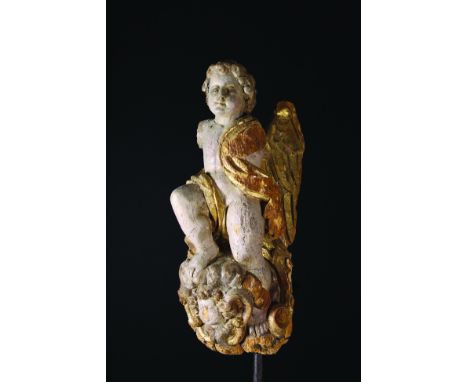A Carved Baroque Figural Architectural Fragment (A/F). The painted & partially gilded wooden carving depicting a winged angel