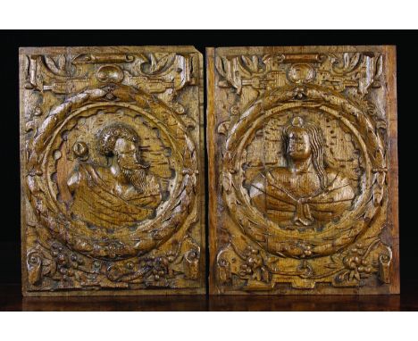 A Pair of 16th Century Carved Oak Romayne Panels depicting portrait busts of a man & wife in laurel wreaths centring scrolled