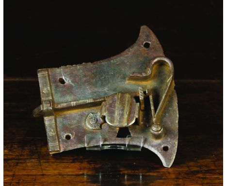 A 16th Century Iron Lock; the axe-head shaped lock plate with incised decoration, 5 ins x 5½ ins (12.4 cm x 13 cm).