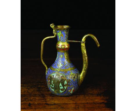 A Rare Late 13th Century Medieval Limoges Altar Cruet (A/F). The copper pear-shaped ewer enriched with engraved enamel work d