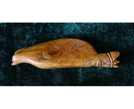 A 14th Century Bone Hide Scraper with carved a King's head finial, 4 ins (10 cms) in length.