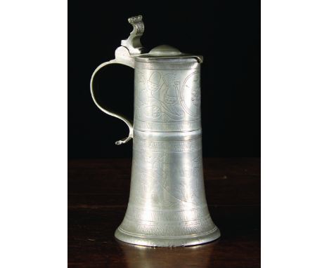 A Fine German Pewter Flagon by Johann Georg Bühler, Circa 1750 decorated with wrigglework depicting a hunting scene below an 