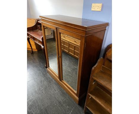 A mahogany two door cabinet, with mirrored doors, 108cm W, 129cm H