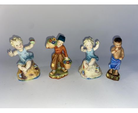 Four Royal Worcester figural ornaments, including a depiction of a Burmese child, the largest 12cm H