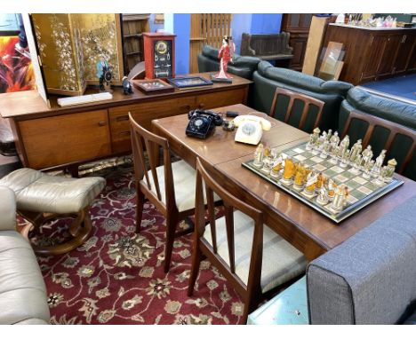 A Teak Youngers Limited sideboard, extending table and four teak single chairs